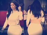 Kim Kardashian Reveals Bra In Backless Top