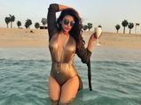 Shama Sikander’s Dubai Trip Summed Up With A Golden Swimsuit & White Shorts