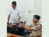 UP Police Officer Gives Foot Massages To Kanwariyas In Medical Camp, Video Goes Viral
