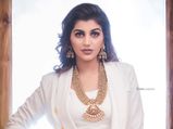 Yashika Aannand Teams Her White Formal Pantsuit With Heavy Gold Jewellery And Sets The New Trend!
