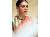 Not Just Her Red Saree, Aditi Rao Hydari’s Striped Blouse And Red Roses-Bun Also Ups Her Look