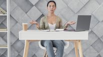 Too Many Meetings, Not Enough Movement? Stretch It Out With Desk Yoga