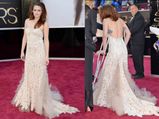 Kristen Stewart Walks Oscars Red Carpet On Crutches