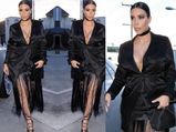 Kim Kardashian Hides Baby Bump & Shows Major Cleavage In All Black Look