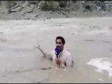 A Journalist Stood In Middle Of The Flooded River To Report