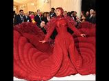 Cardi B Proves That She Is The Queen Of The Camp With This 10-Foot Long Ruby Gown