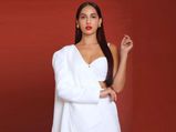 Nora Fatehi Sizzles In A White Pantsuit At The Batla House Promotion Event