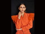 Rakul Preet Singh Sizzles In A Bright Orange Frilly Crop Top Blazer And High Rise Pencil Pants