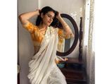 Fatima Sana Shaikh Reminds Us Of Yesteryear Actresses With Her Orange and White Saree Look