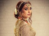 Naagin Actress Surbhi Jyoti Exudes Diva Vibes In A Heavily Embellished Peach Orange Bridal Lehenga