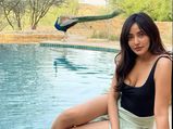 Neha Sharma Exudes Summer Vibes In Her Chic Outfit As She Chills With Peacock And Relaxes In The Lap Of Nature