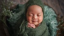 Why Do Newborns Smile In Their Sleep?