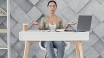 Too Many Meetings, Not Enough Movement? Stretch It Out With Desk Yoga