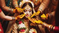 Why Do Indian Brides Get Covered In Haldi On Their Wedding Day? It's More Than Skin Deep