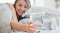 Stop Drinking Water Before Bed? Here's What Doctors Want You To Know About The Risks