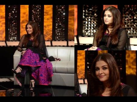 In black and pink suit