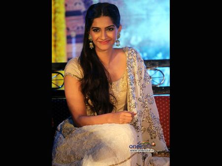 Jhumkas and side parted hair