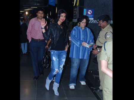 Shredded jeans with ankle boots