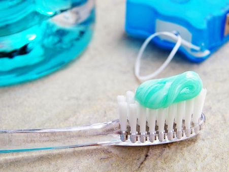 Use the back of the toothbrush