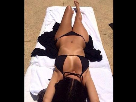 Showing Off Her Toned Tummy