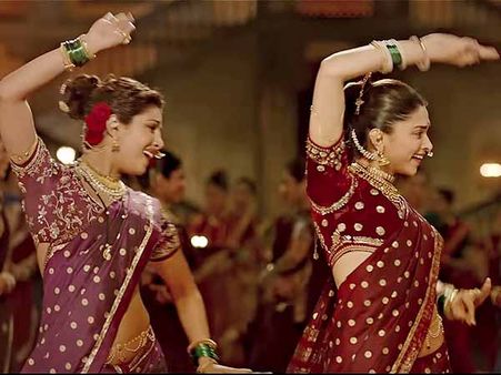 5. Purple and Red Sarees: