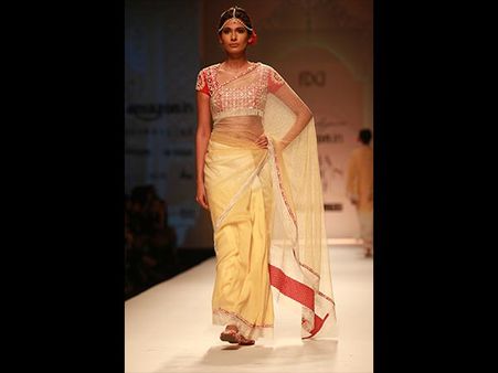 Yellow Net Saree + Red Blouse Yellow Net Saree + Red Blouse