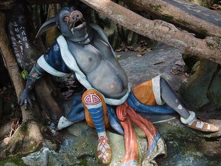 The Man-Pig Statue In Haw Par Villa, Singapore The Man-Pig Statue In Haw Par Villa, Singapore