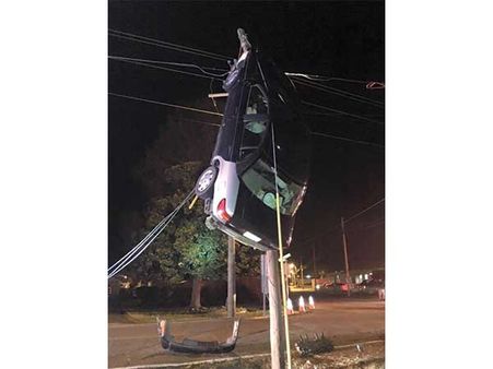 The Car That Got Stuck On A Utility Pole 