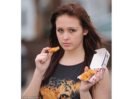 A Girl On A Diet With Chicken Nuggets
