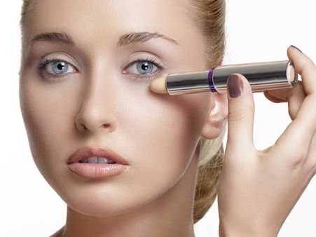 Adding A Tint Of Shimmery Highlighter To Create A Perfect Illusion