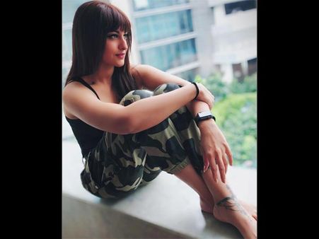 Sleek Yet Elegant Straightened Hair With Blunt Bangs