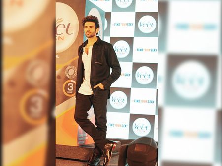 Kartik Aaryan In White T-shirt, Black Jacket, And Pants
