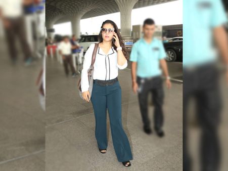 Kajol In A White Shirt And Blue Hued Pants Kajol In A White Shirt And Blue Hued Pants