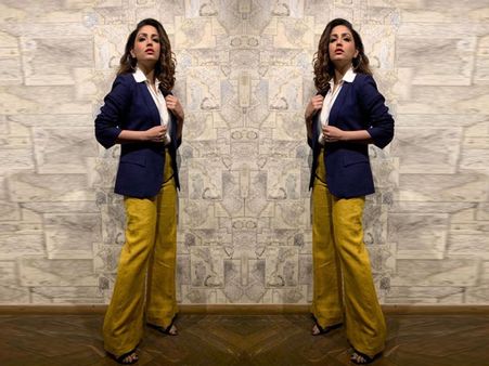 Yami Gautam In A White Shirt And Dark Yellow Pants