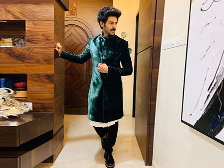 Karik Aaryan In An Ivory Kurta, Green Sherwani, And Pants