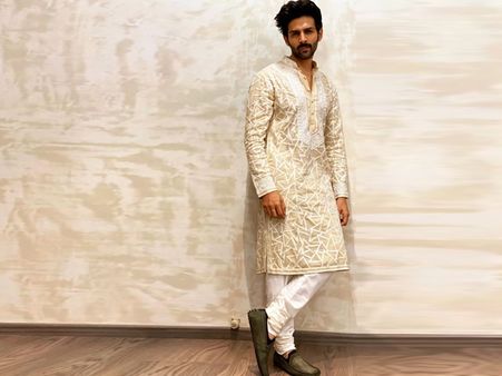 Kartik Aaryan In A Beige Hued Kurta And White Churidars