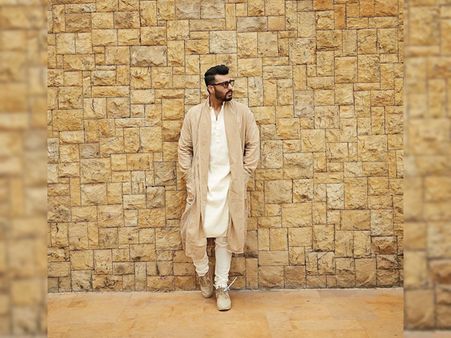 Arjun Kapoor In An Ivory Kurta Set And Beige Jacket