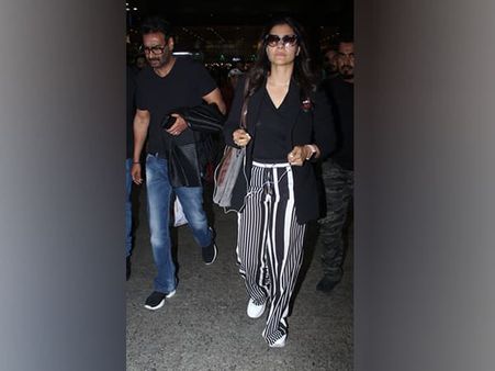 Kajol In A Black Tee, Blazer And Striped Trousers