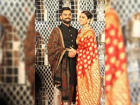 Virat Kohli And Anushka Sharma's Reception Outfits