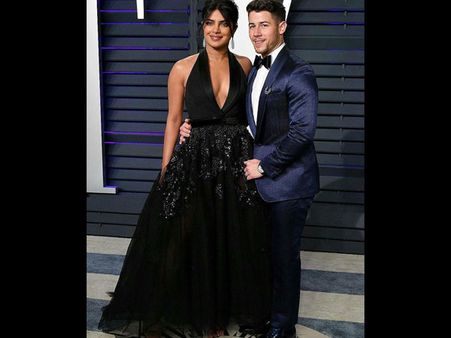 Priyanka Chopra Jonas In Black Gown And Nick Jonas In Blue Tuxedo