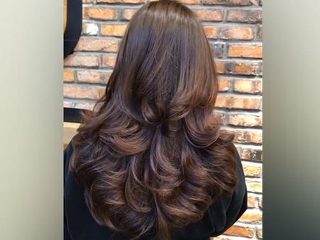 10. Bouncy Wavy Layered Cut