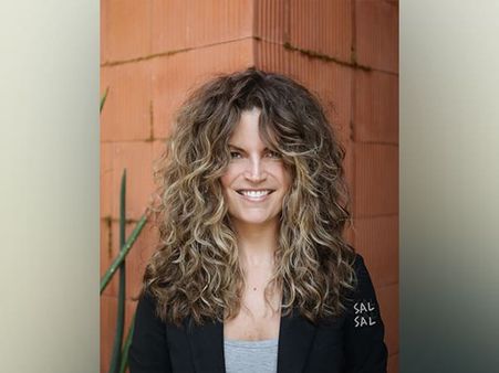 20. Curls With Short Bangs