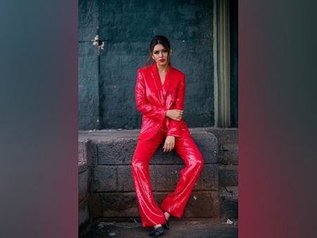 Hansika Motwani In A Red Shiny Pantsuit Hansika Motwani In A Red Shiny Pantsuit