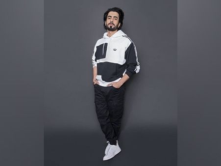 Sunny Singh In A Black And White Hoodie
