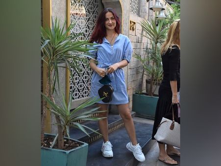 Elli AvrRam In A Blue Belted Dress