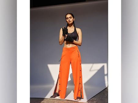 Manushi Chhillar In A Black Crop Top And Orange Pants