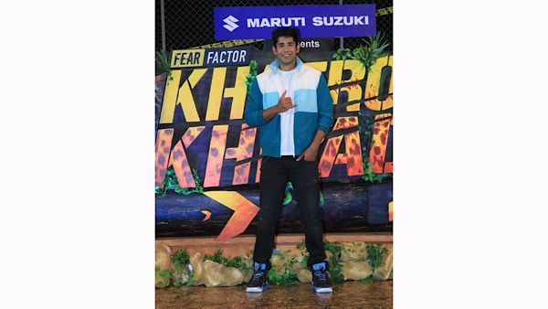 Varun Sood In A Black And White Attire With Green Jacket