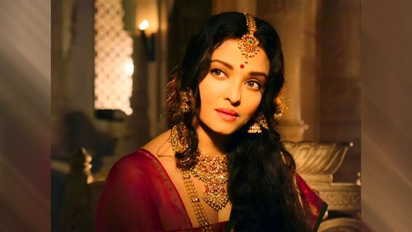 Red Saree, Mookuthi, and Long Tresses