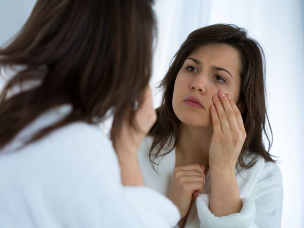 woman looking in mirror 