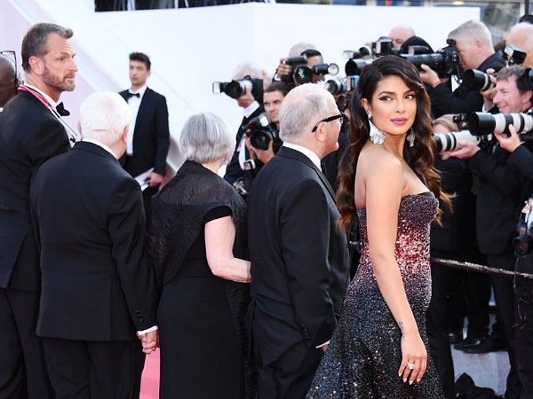 Priyanka Chopra Makes Her Cannes Debut in a Glittering Black High Leg Slit Dress